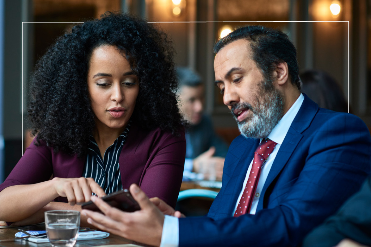 two people looking at phone screen